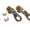 A set of EVERBRIGHT brass zipper components including two zipper pulls, two bottom stops, and a set of top stops laid out on a white surface.