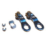 A set of nickel zippers and stops, zipper pulls and zipper stops laid out on a white surface.