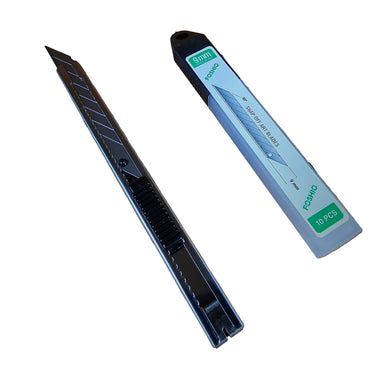 Retractable utility knife with a snap-off blade next to its packaging, placed on a surface with a white background.