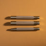 Three metal rivet setters with the craftplus logo visible. Laid out on a brown textured leather background.