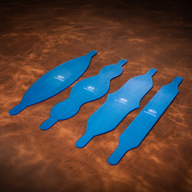 Four blue acrylic templates used for creating a nose straps made of leather for a horse, set on a brown textured leather background.