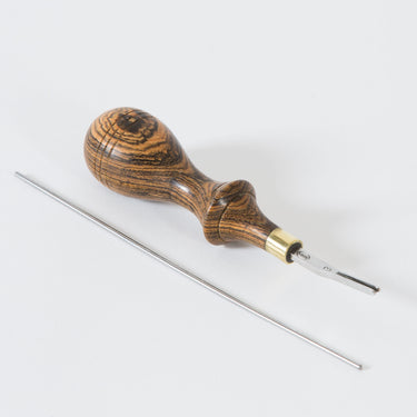 Montana Edger tool 3 by Ron's Tools with a metal tip and wooden handle, used for leatherworking and leathercraft creating fine edges on leather, displayed on a white background