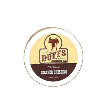 A container of Duffs Leather Dressing placed on a white surface.