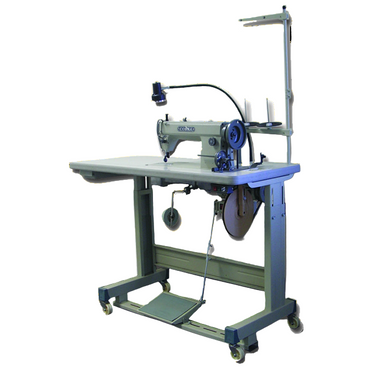 A Cobra Class 5550BB boot top sewing machine with a roller foot and feed dog mechanism, featuring a large 'M' style bobbin and heavy-duty construction.