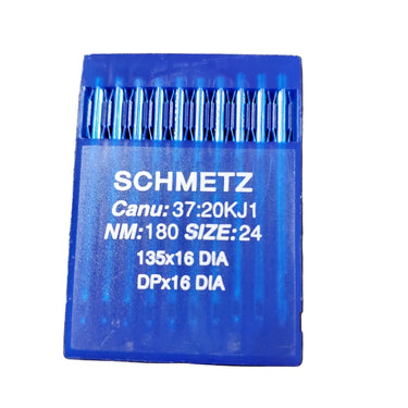 A pack of SCHMETZ sewing machine needles displayed on a surface, with the brand name visible on the packaging.