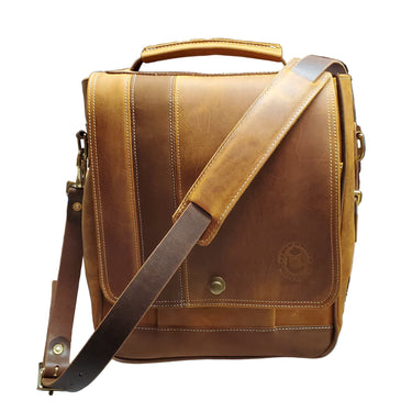 A brown messenger bag with a leather shoulder strap, sitting on a white background.