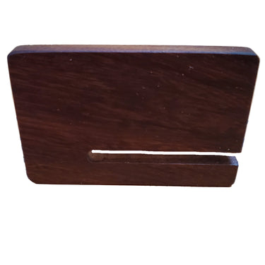 A rectangular rosewood pricking iron pull-out board with a groove in the center, placed on a white background.