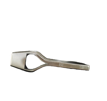 A metal bag punch tool next to a white background.