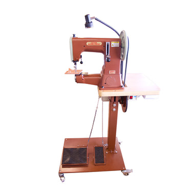A brown Cobra Class 3 sewing machine on a pedestal stand with wheels, designed for leather crafting.