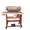 A Cobra AK20 PLUS Strap Cutter machine, primarily in brown color, designed for cutting straps and belts.