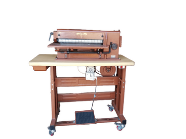 A Cobra AK20 PLUS Strap Cutter machine, primarily in brown color, designed for cutting straps and belts.