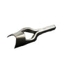 A solid metal strap end punch tool lying on a white surface.