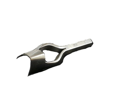 A solid metal strap end punch tool lying on a white surface.