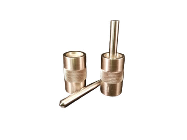Two metal snap setters with a textured grip, one standing upright and the other lying horizontally, on a white background.