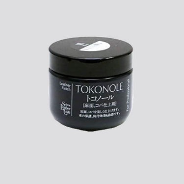 Black jar of Tokonole leather finish on a white background