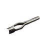 A metal strap end punch tool lying on a white surface.